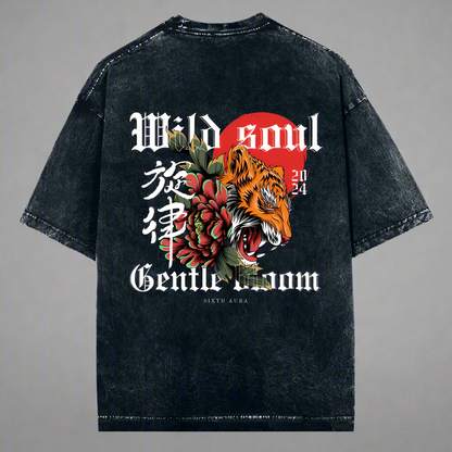 A black oversized t-shirt with text and a graphic design featuring a tiger and a floral pattern on the front.