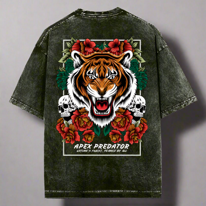 Oversized green t-shirt with a front graphic of a tiger and the text 'APEX PREDATOR', surrounded by floral elements and skulls.